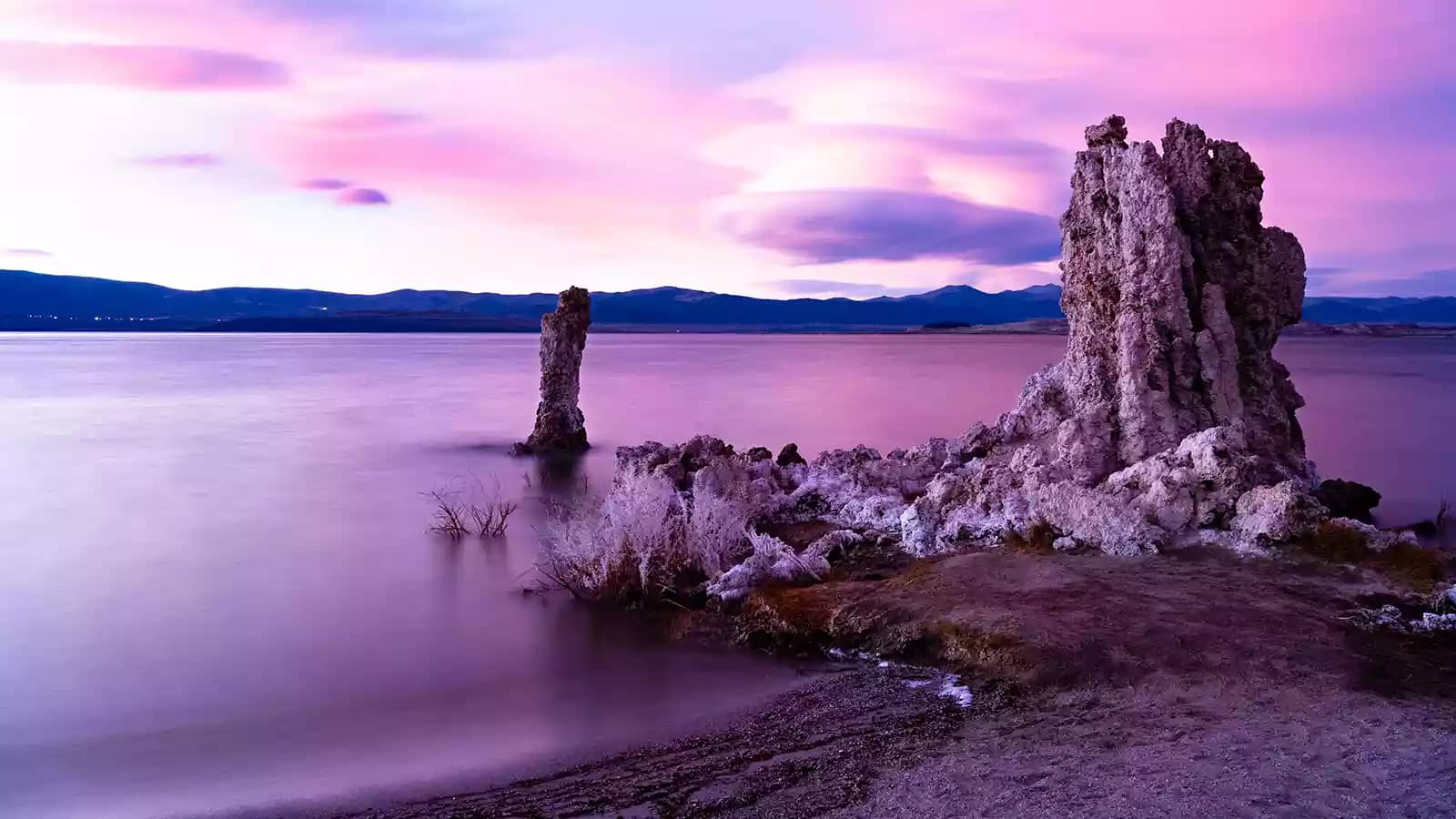 Knobbly tufa towers rise from the waters of Mono Lake, one of the most unique destinations for camping near California state parks.