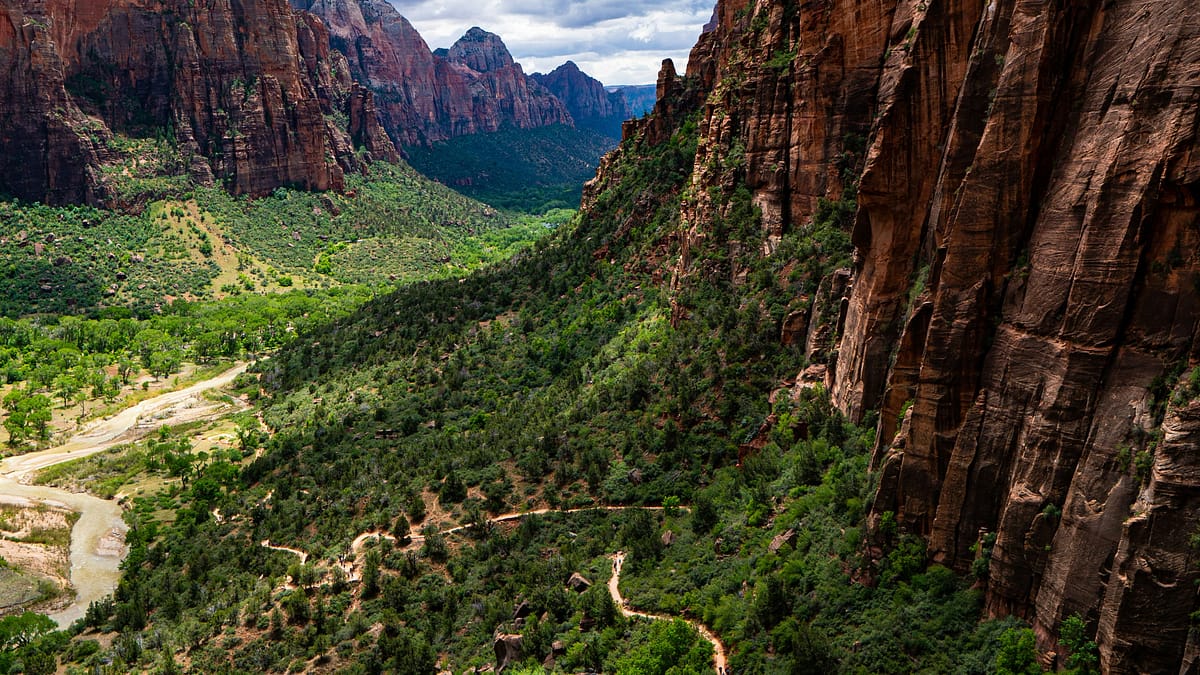 A wide-angle photo of a large section of Zion National Park, showing hiking and backpacking trails, and what's known as Angels Landing.
