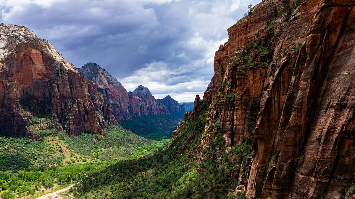 Large sweeping canyon scenery or landscape from Zion National Park on a cloudy day. Photo by Joshua Gresham.