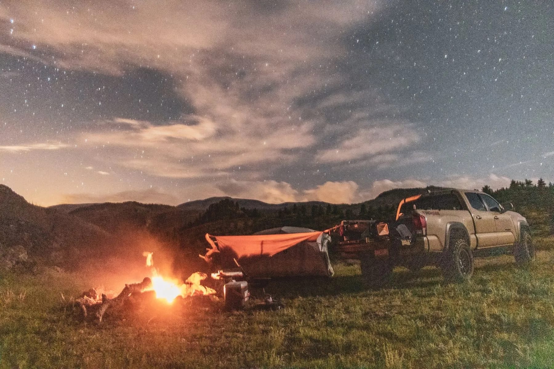 Campers in Colorado with a nearby campfire