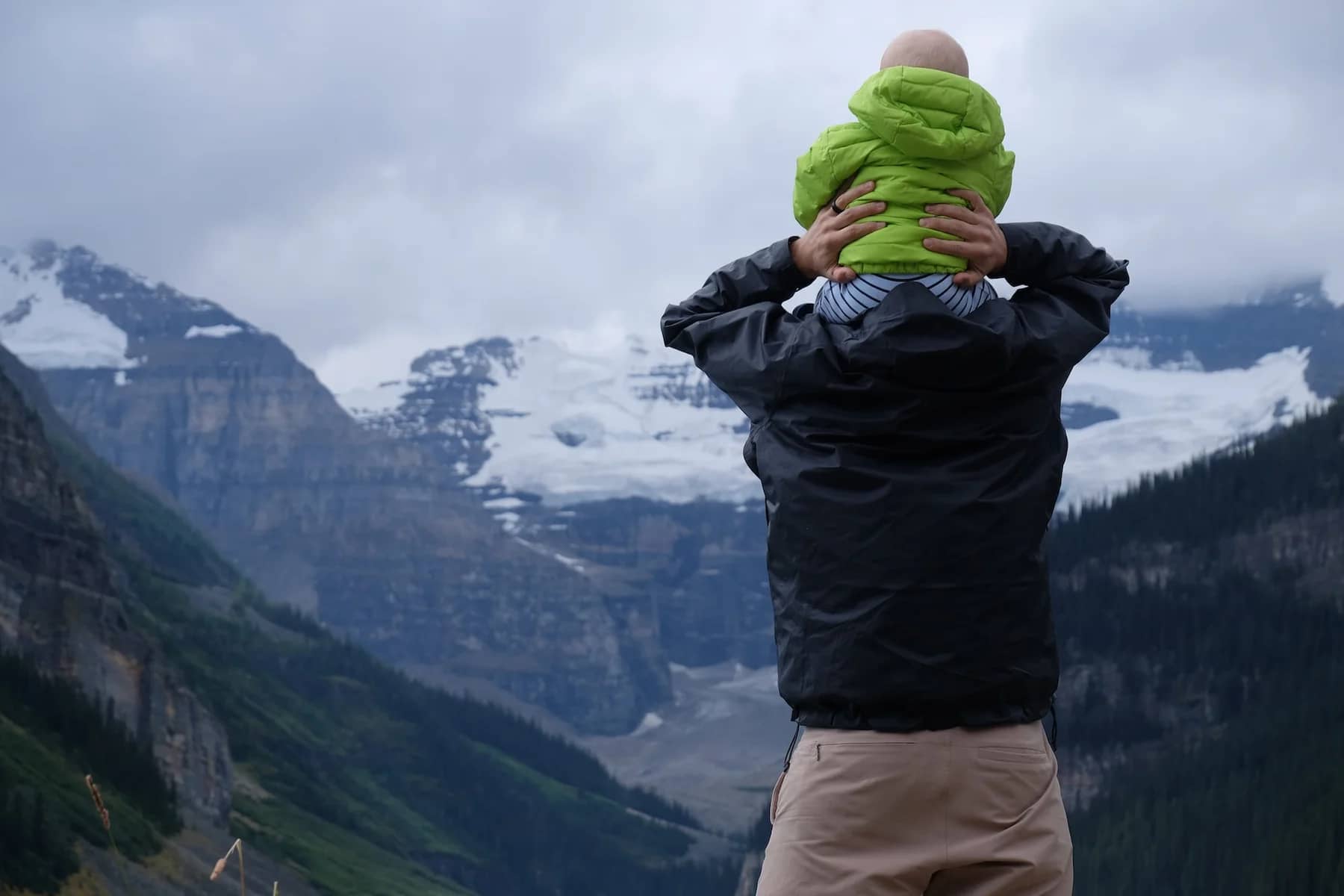 Image of Dad and toddler looking at mountains to convey RVing with babies and toddlers