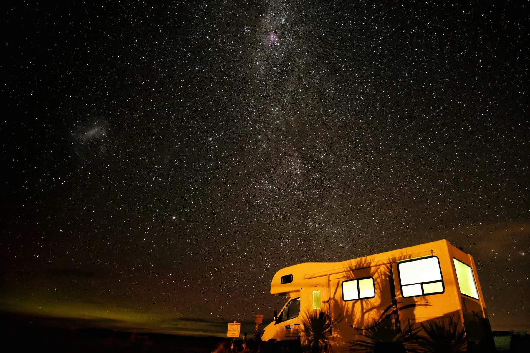 Image of an RV at night to showcase the best astro tourism gear